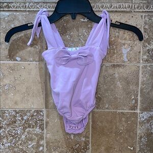 Baileys blossoms Lavender Baby Onesie with Bow and adjustable bow straps